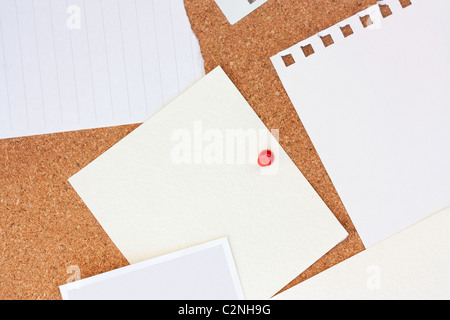 close up macro shot of lots of blank paper and notes on a pinboard Stock Photo