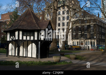 Pseudo-Tudor, half-timbered, gardner's hut and green space, Soho Square, central London W1, England Stock Photo