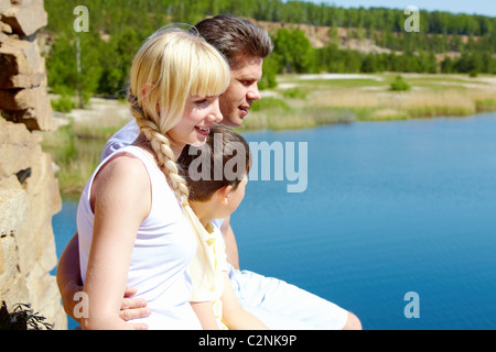 Photo of three family members on summer day outdoors Stock Photo