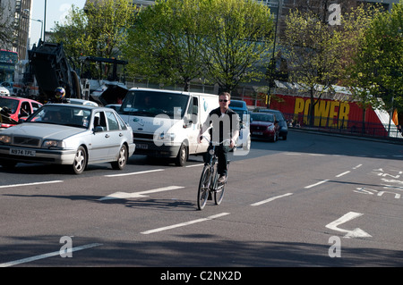 Cyclist, Elephant and Castle northern roundabout, Southwark, London, UK Stock Photo