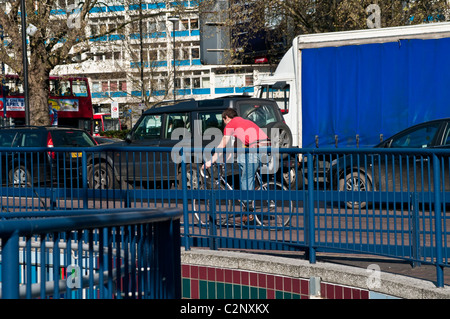 Cyclist, Elephant and Castle northern roundabout, Southwark, London, UK Stock Photo