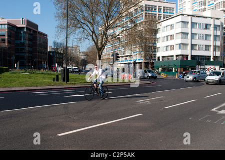 Cyclist, Elephant and Castle northern roundabout, Southwark, London, UK Stock Photo