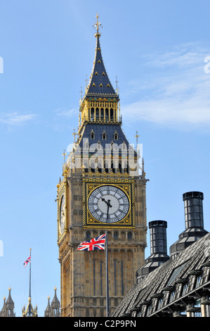 Iconic famous historical Victorian neo-Gothic Big Ben Elizabeth clock tower Union Jack Flag roof chimneys of Portcullis House London England UK Stock Photo