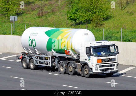 BP gas tanker trailer and white hgv lorry truck with Hazchem Hazardous Chemicals Dangerous Goods & material warning sign England UK Stock Photo
