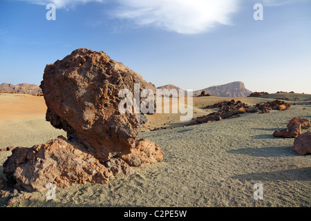 Volcanic desert at Tenerife Canary island. Blue sky, arid dry sand heat, rocky lava. Scenic geology formation landmark. Lunar landscape exploration. Stock Photo