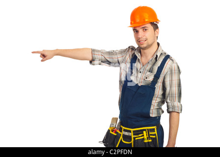 Builder man pointing to side to copy space isolated on white background Stock Photo