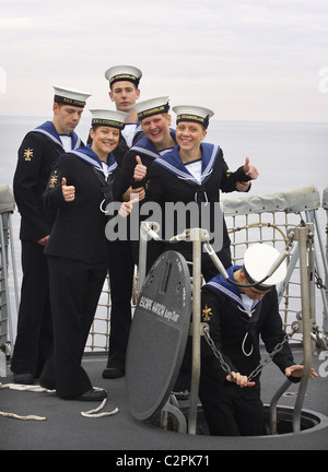 Members of HMS Cumberland's crew prepare to leave the ship after a 7 month deployment. Stock Photo