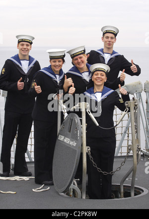 Members of HMS Cumberland's crew prepare to leave the ship after a 7 month deployment. Stock Photo