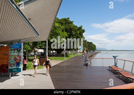 Tourists walking along Esplanade boardwalk. Cairns, Queensland, Australia Stock Photo