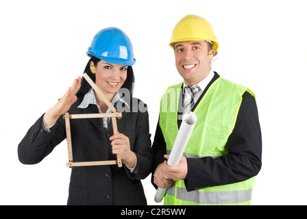 Two very happy architects with projects for house and house symbol Stock Photo