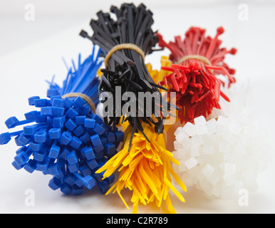 A cable tie tensioning device or tool may be used to apply a cable tie with a specific degree of tension. Stock Photo