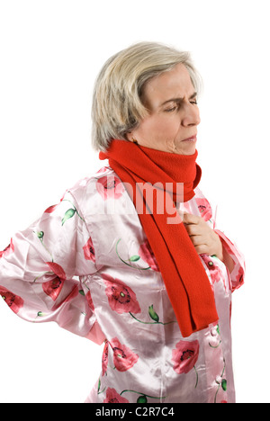 Senior woman having a backache and a chest pain Stock Photo