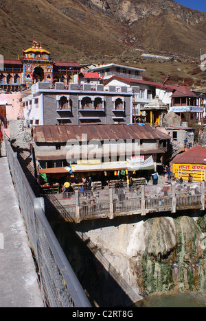 Garhwal Himalayas, India: A view of the Badrinath Temple complext, viewed from a bridge spanning the Alakananda river. Stock Photo