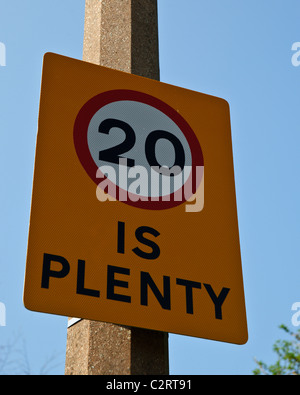 20 is plenty road speed limit sign attached to a lamp post in Littlehampton, West Sussex Stock Photo