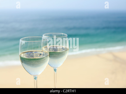 Two glasses of wine by the ocean Stock Photo