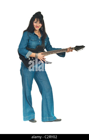 Beautiful brunette woman in denim clothes playing guitar isolated on white background Stock Photo
