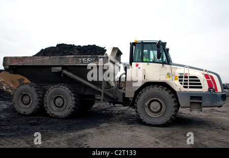 Industrial waste treatment plant, England - large dumper truck on landfill site Stock Photo
