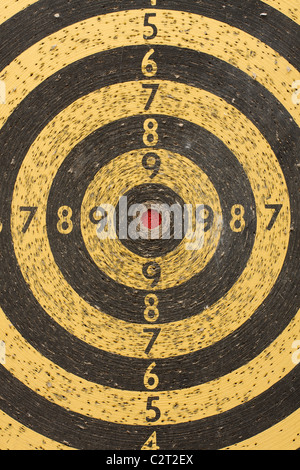 Target board for darts, many holes on it Stock Photo