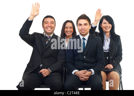 Business people at course or auction raise hands and laughing Stock Photo