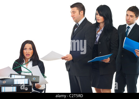 Busy stressed servant public tied in a chair at desktop working hard and other business people standing in a row and wait turn Stock Photo