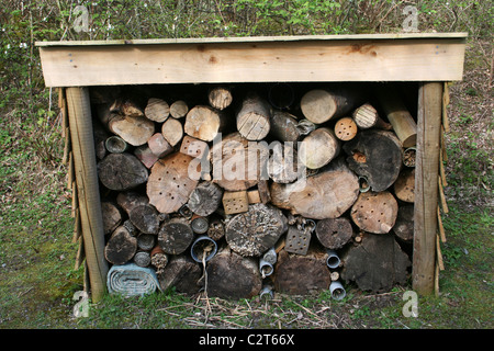 Insect Friendly Housing In A Log Pile At Conwy RSPB Reserve, Wales, UK Stock Photo