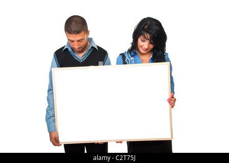 Two business people holding a cardboard and looking down to copy space isolated on white background Stock Photo