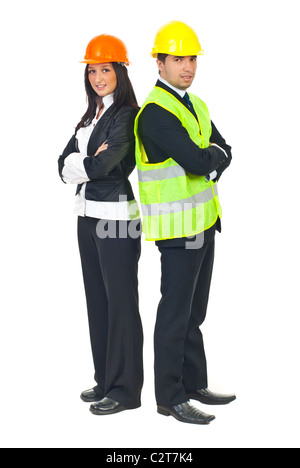 Two young architects team man and woman standing back to back with hands crossed isolated on white background Stock Photo