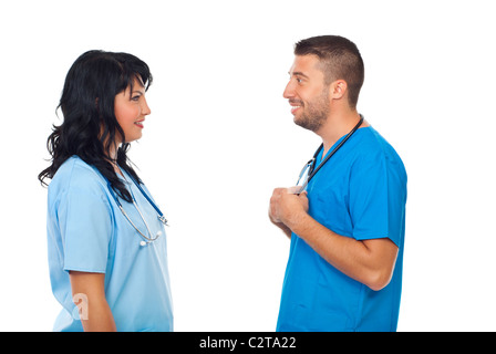 Two doctors standing face to face and having an conversation isolated on white background Stock Photo