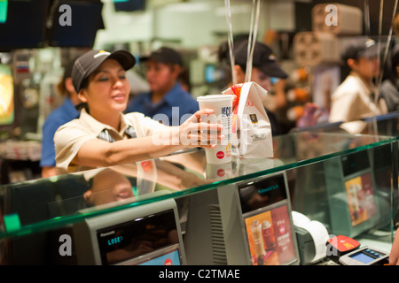 Employees of a McDonald's restaurant in New York serve customers Stock Photo