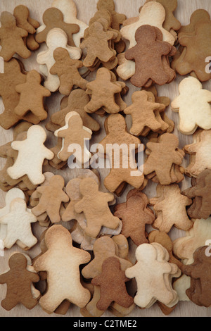 High angle close up of Gingerbread Men on a baking tray. Stock Photo by  Mint_Images