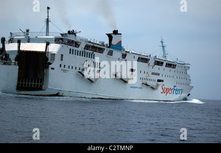 Philippine Super Ferry transports passengers across the seas off Puerto Galera, Mindoro, Philippines. Stock Photo