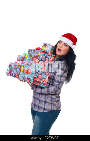 Surprised woman holding Christmas presents with risk to fall isolated on white background Stock Photo