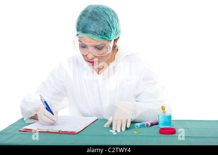 laboratory woman making experiments and taking notes on clipboard Stock Photo