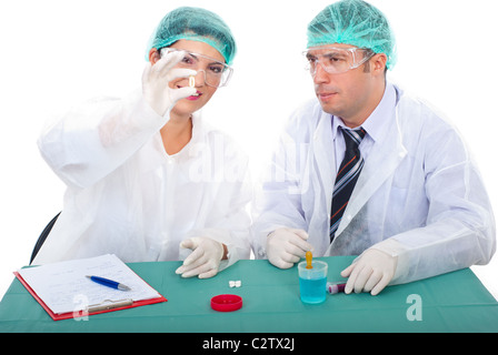 Pharmacist teamwork studying oil capsule with Omega-3 and having conversation together in laboratory Stock Photo