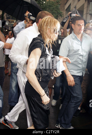 Guy Ritchie and Madonna arriving at the Kabbalah center with their children after getting caught in the rain New York City, USA Stock Photo