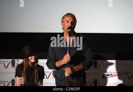 Kevin Costner and his co-star Madeline Carroll speak to an audience before a screening of their new film 'Swing Vote' at the Stock Photo