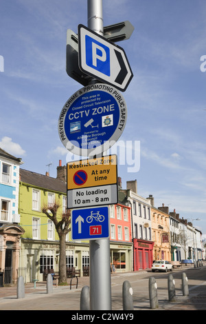Cockermouth Cumbria England UK. Signs for restricted parking, car park, CCTV Zone and Sustrans cycle route 71 in town centre Stock Photo