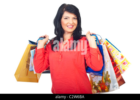 Happy woman holding many shopping bags on her back isolated on white background Stock Photo