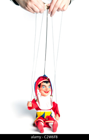 manipulator controlling a Jester marionette Stock Photo