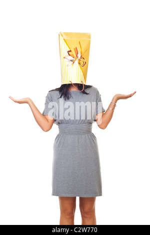 Woman holding a bag on his head and wondering what to buy isolated on white background Stock Photo
