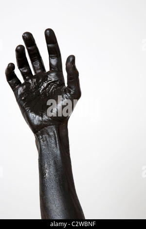 Black painted hand and arm Stock Photo
