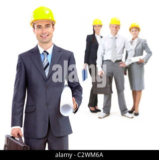 Collage of confident architects in helmets with their leader in front Stock Photo