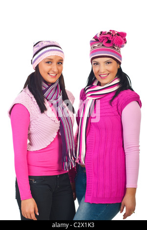 Two smiling attractive women in pink winter knitted clothes isolated on white background Stock Photo
