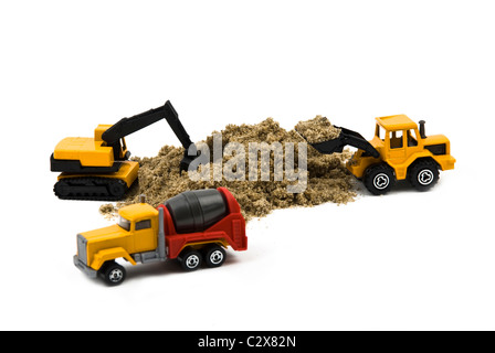 Machines miniature :cement mixer truck,wheel loader and hydraulic excavator working isolated on white background Stock Photo