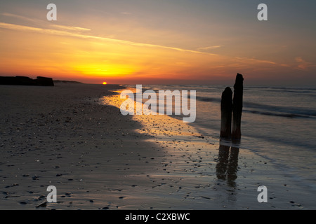 Sunset over the beach at Titchwell nature reserve, Norfolk, Uk Stock Photo