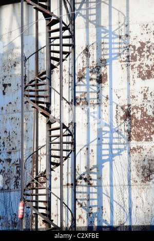 Stairs on a old  rusty metal gas tank Stock Photo