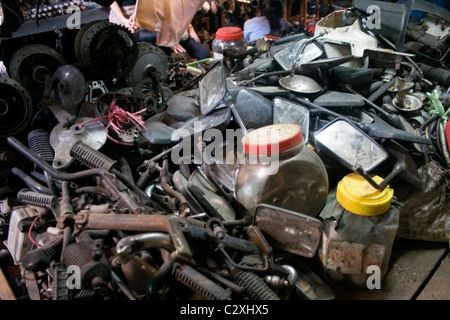 Used motorcycle parts are for sale at a second hand shop at the Russian Market in Phnom Penh, Cambodia. Stock Photo