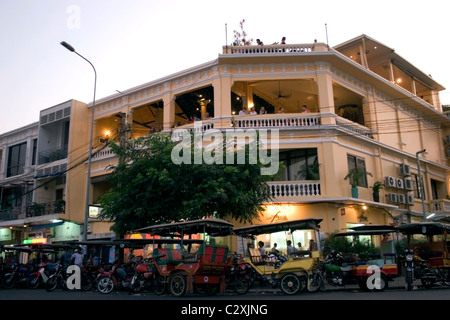 Tuk tuks (taxis) are parked on a street in front of the FCC in Phnom Penh, Cambodia. Stock Photo