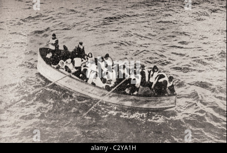 Survivors of the RMS Titanic in one of her collapsible lifeboats, just before being picked up by the Carpathia. Stock Photo