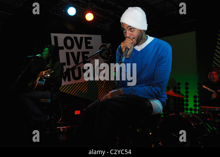 Disashi Lumumba-Kasongo and Travis McCoy  Gym Class Heroes perform for the launch of their new album 'The Quilt' at Zavvi Stock Photo